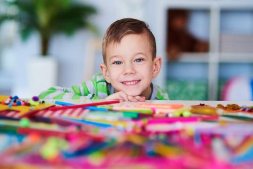 portrait-of-happy-preschooler-with-big-smile-on-FMUJA2X-1.jpg